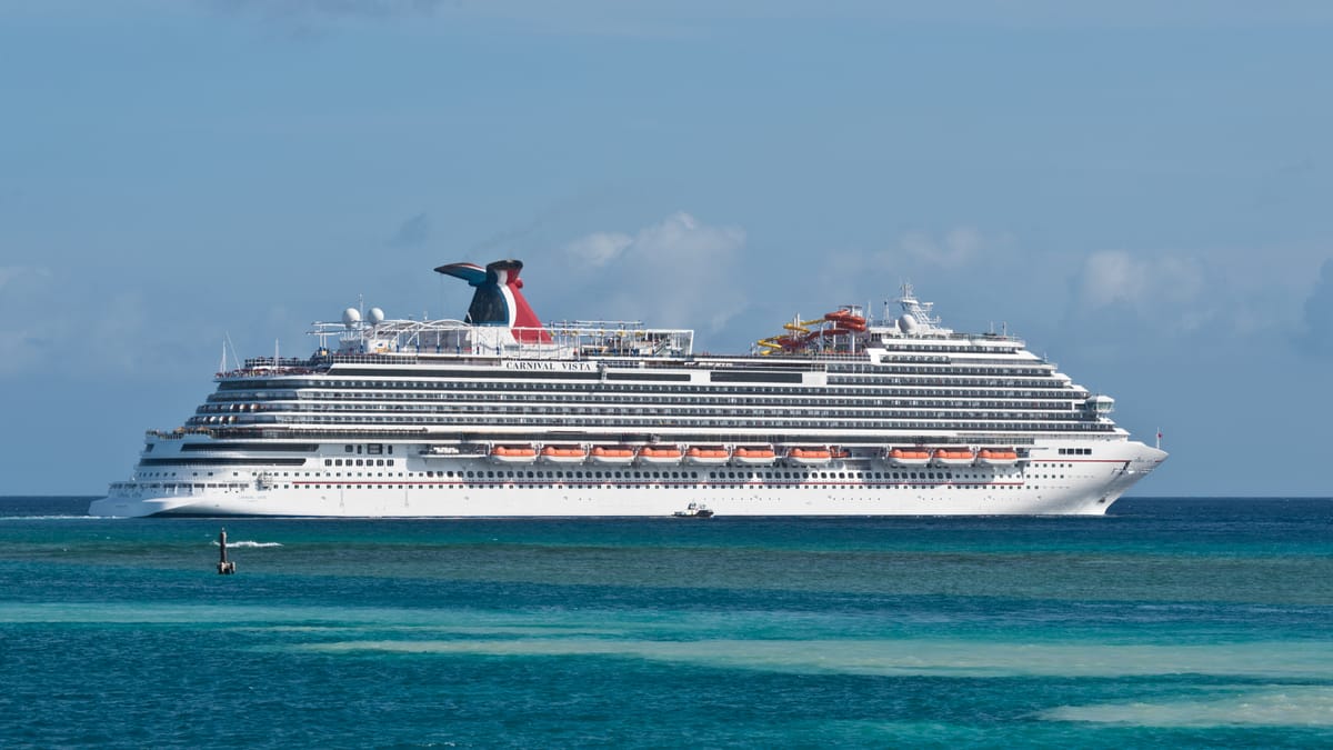Carnival Vista off Aruba — illustrative of the Caribbean port-day rhythm Excel-class inherits.