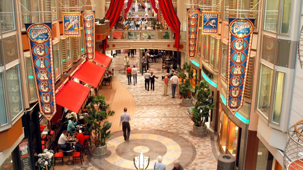 The Royal Promenade — the indoor neighborhood Royal Caribbean built around starting with Voyager-class.