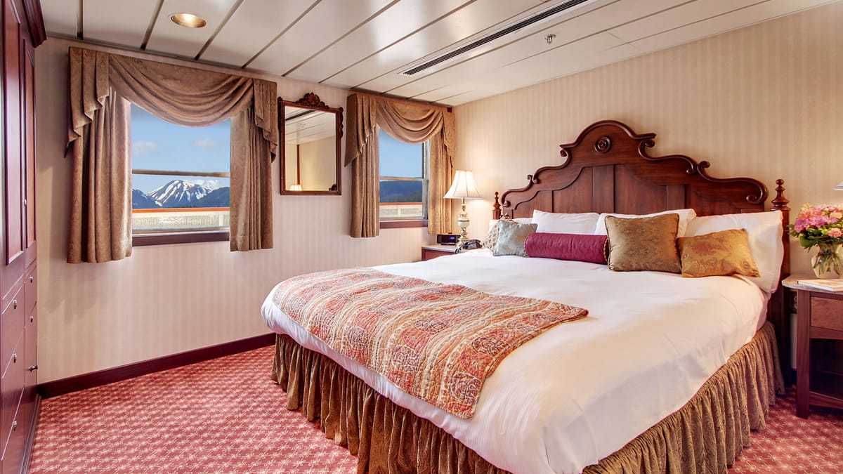 An owner's-suite bedroom — illustrative of the highest cabin tier.