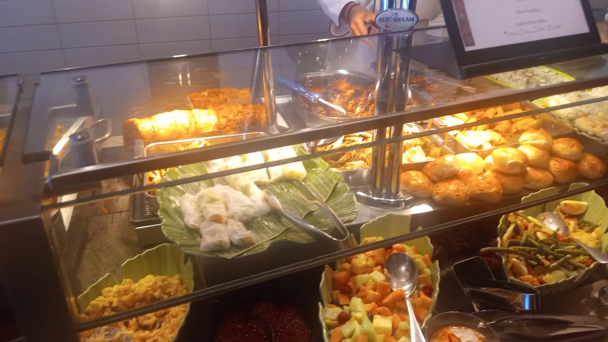 A hot-food service line — illustrative of the multi-station Indulge Food Hall format.